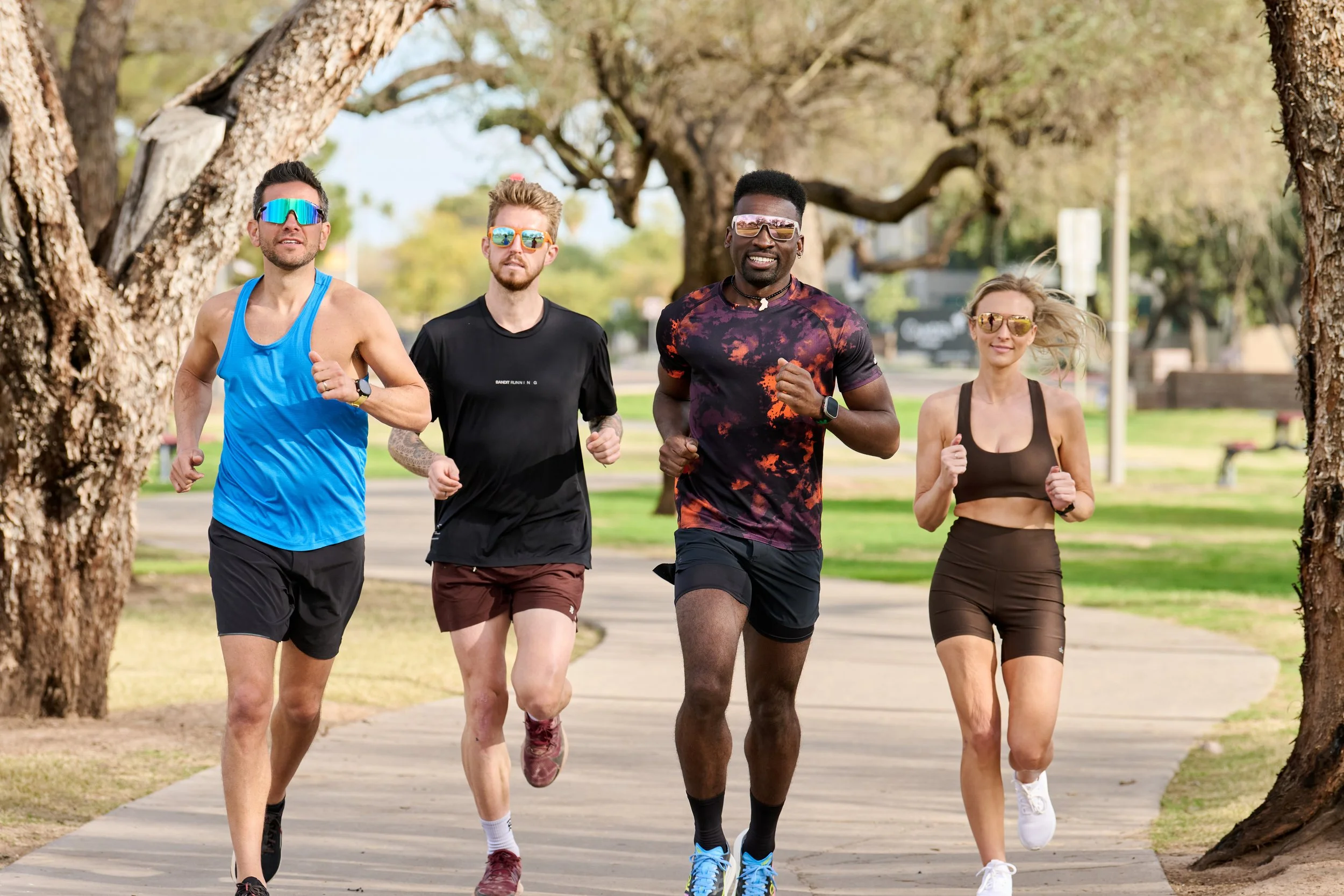 Athletes wearing Tifosi sunglasses during a group run